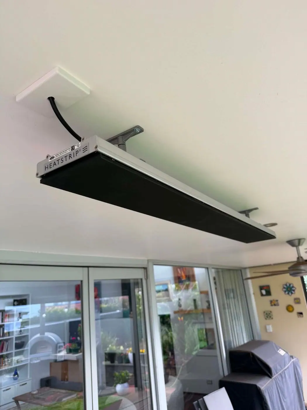 Second Heatstrip radiant heater mounted to the alfresco ceiling in Norwood