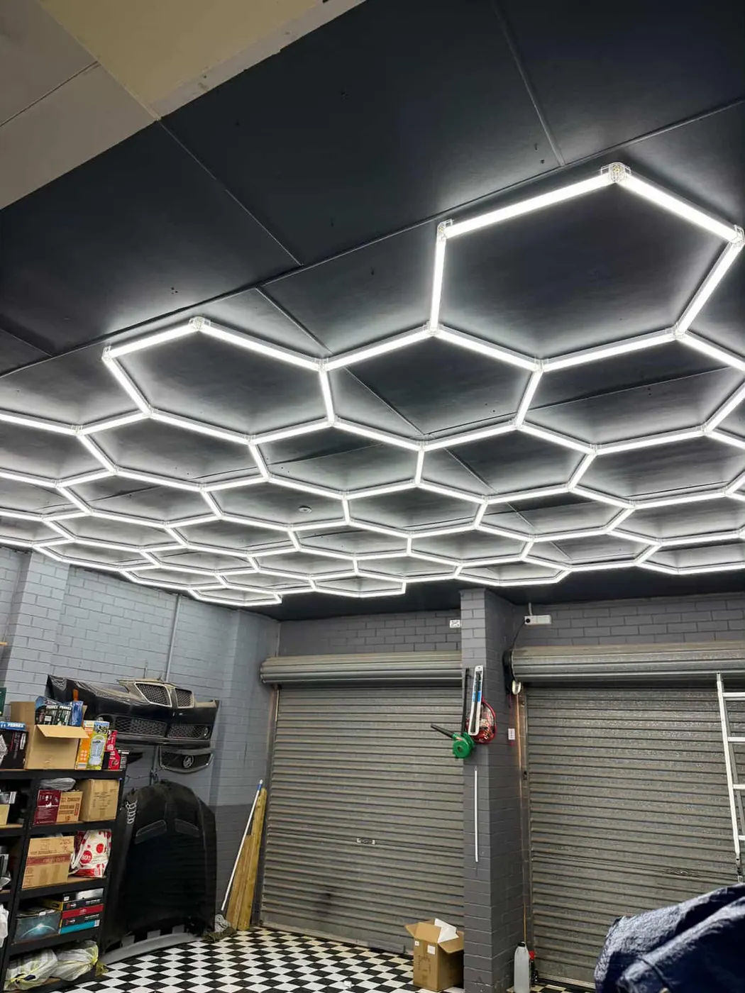 Hexagon LED lighting array mounted across a garage ceiling in Fairview Park