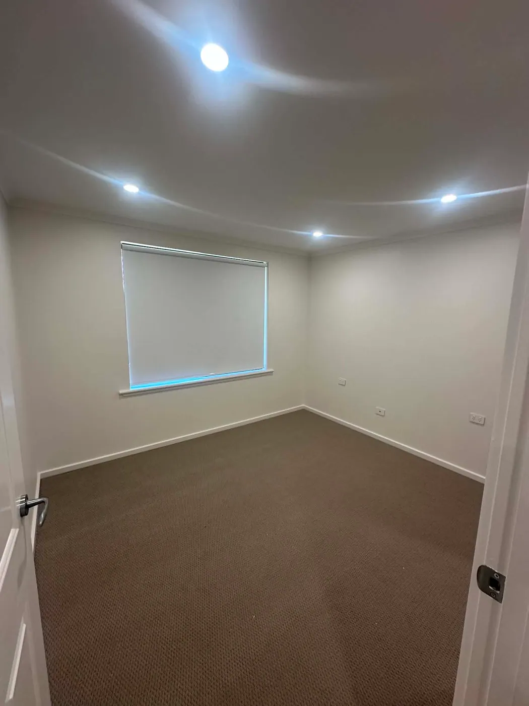 Bedroom with new LED downlights installed during a Hope Valley renovation
