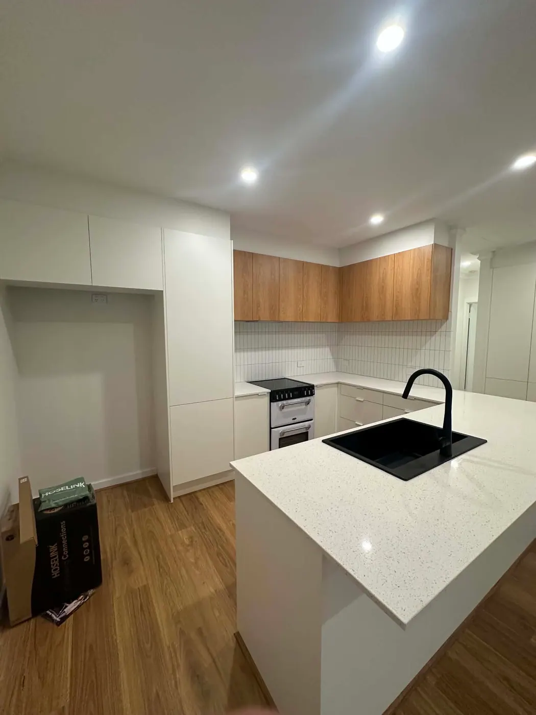 Golden Grove kitchen with new LED downlights, new benchtop and new appliances