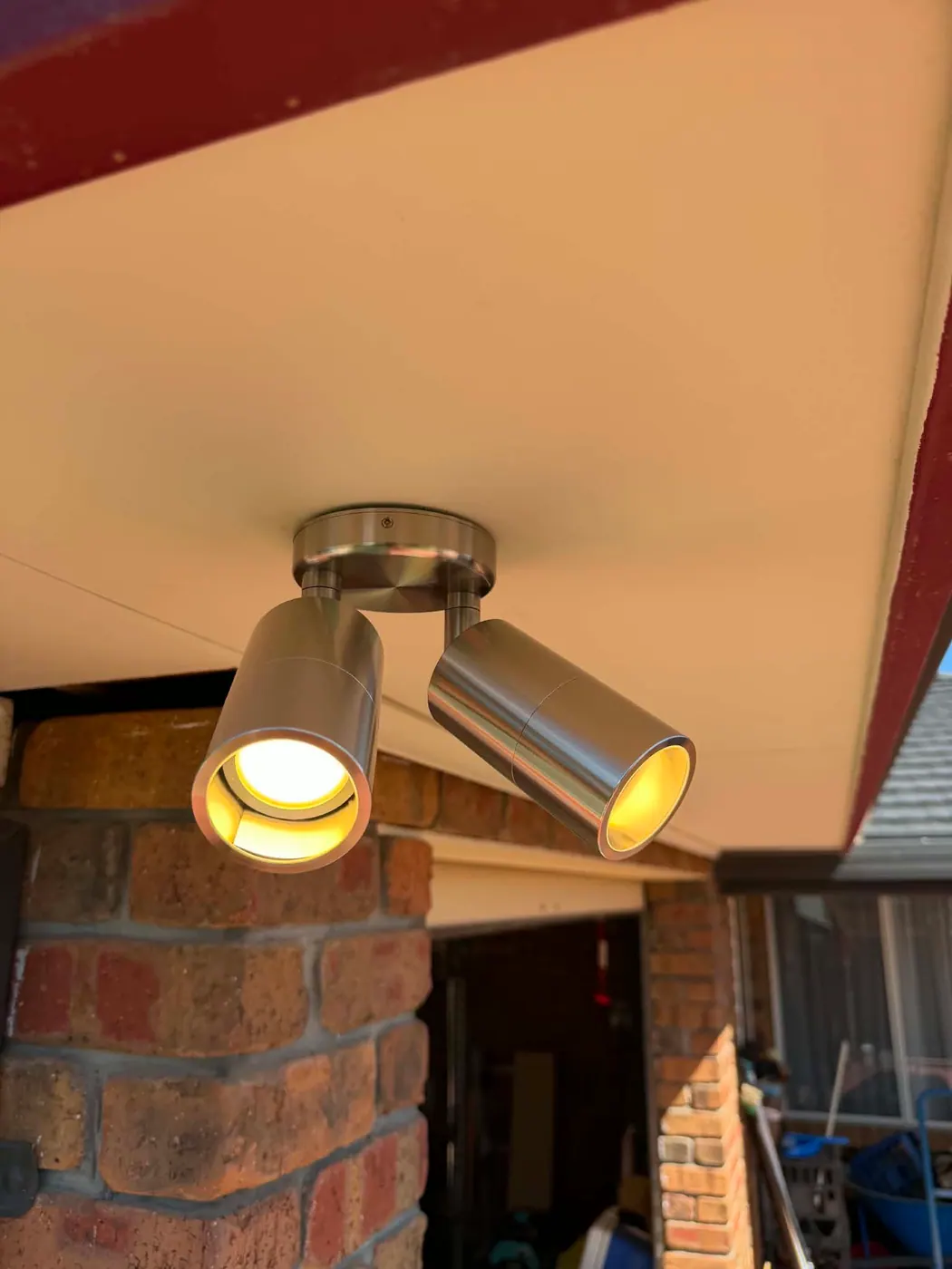 Twin-head outdoor spotlight lighting a pool area at a Golden Grove home